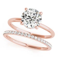 Timeless Classic Solitaire Diamond Engagement Ring in 18ct Rose Gold. Adorned with a brilliant 2ct Round Brilliant Cut diamond, hidden halo gallery, and meticulous diamond detailing. Crafted with fine workmanship, total diamond weight 2.25ct. Available at